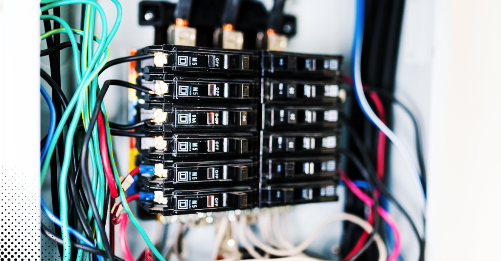 Close-up of a residential electrical breaker panel with wiring.